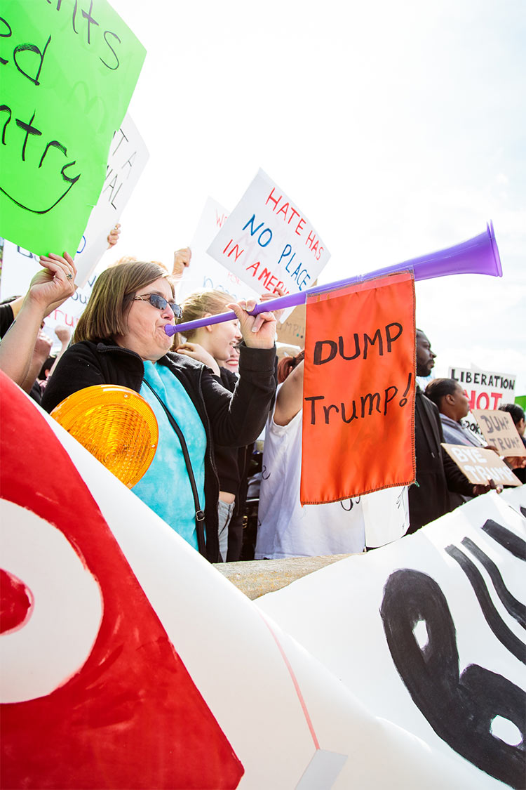 Protesters were corralled into a "Free Speech Zone," separated from the long line of people waiting to get into the rally. Trump's campaign has earned a reputation of violence, with Trump encouraging his supporters to aggressively eject protesters. As Trump was arriving in Wisconsin, his campaign manager was charged with simple battery for an incident earlier in the month.