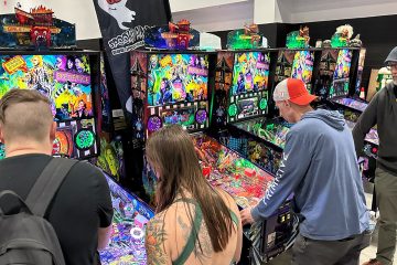 People playing pinball at the 2026 Midwest Gaming Classic in Milwaukee, Wisconsin