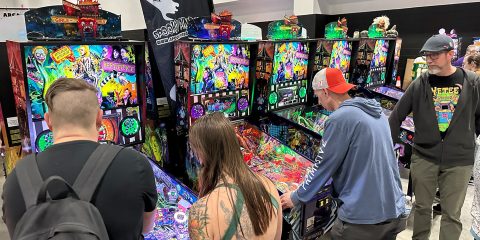 People playing pinball at the 2026 Midwest Gaming Classic in Milwaukee, Wisconsin