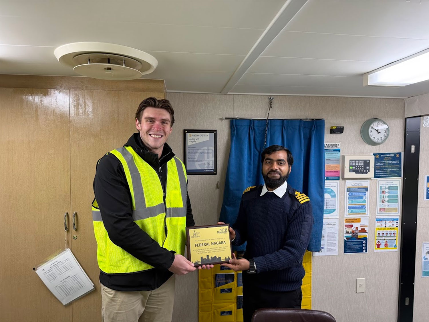 Federal Nagara captain receiving a plaque in Milwaukee, Wisconsin
