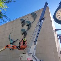 Watch Algonkian Indian and Whistling Swan sculpture move from old museum to new museum